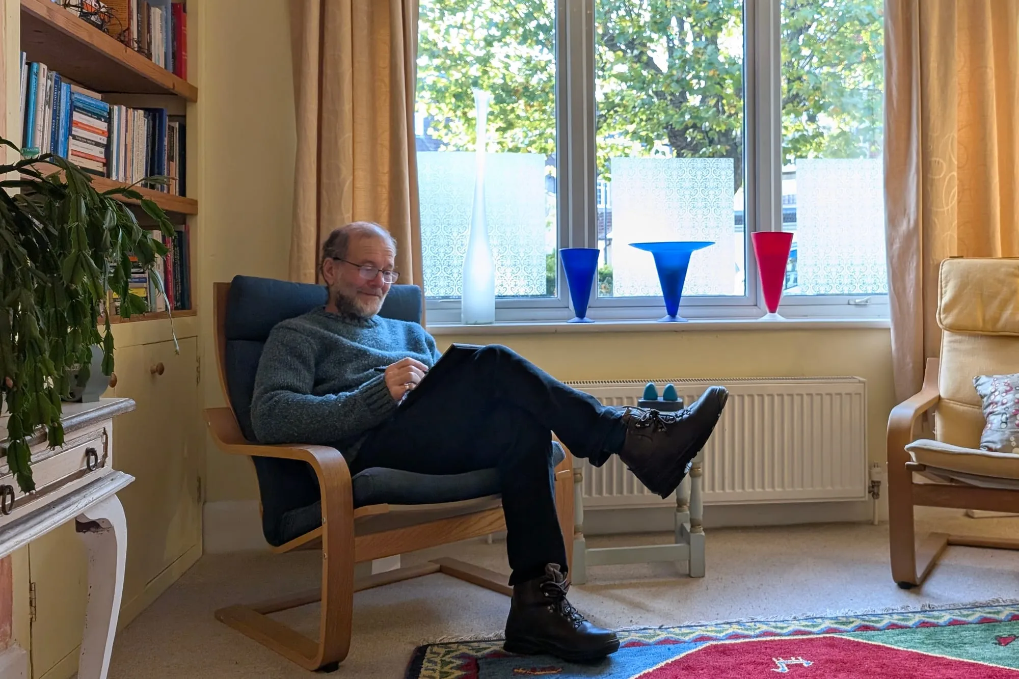 Ryan Solomon seated in his Henleaze consulting room